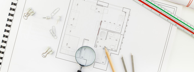 Interior designer table workplace with house plan