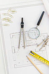 Interior designer table workplace with house plan