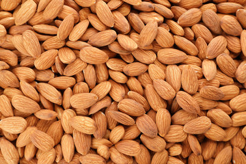 Organic almond nuts as background, top view. Healthy snack