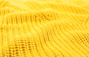 Texture of cozy warm sweater as background, closeup