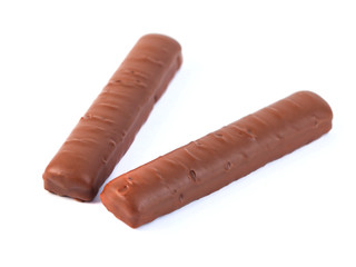 chocolate sticks with caramel on a white background