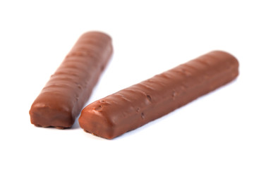 chocolate sticks with caramel on a white background