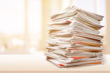 File folders with documents on white table