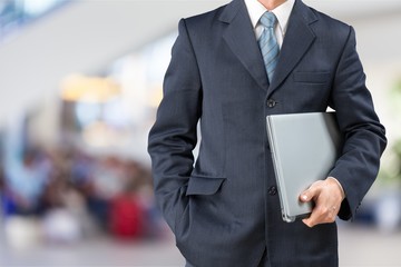 Man with laptop in libarary