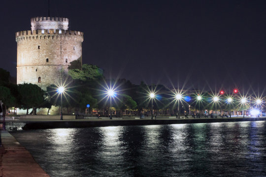 The white tower of Thessaloniki and the port with reflections on the water