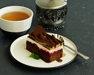 Brownie with cherry and mousse.