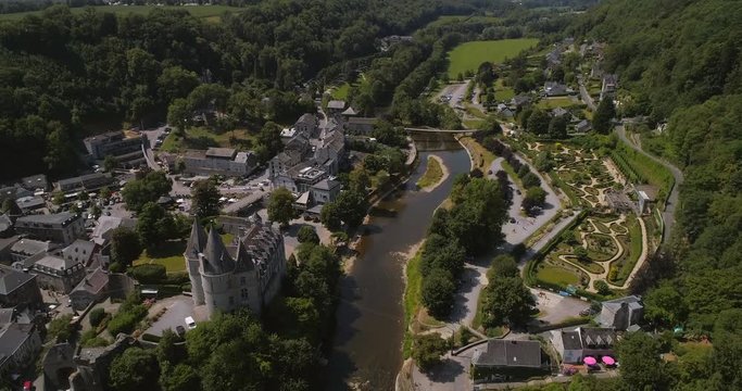 aerial of the Ourthe River and castle at Durbuy FLYING BACKWARD