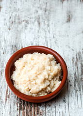 Rissoto served in a clay plate