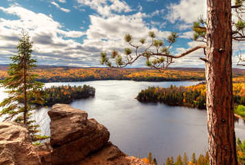 View over Fall forest and lake with colorful trees from above in Algonquin Park, Canada - obrazy, fototapety, plakaty