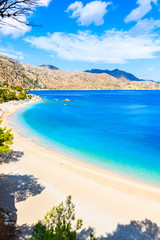 Fototapeta na wymiar Azure sea at beautiful Apella beach on Karpathos island, Greece
