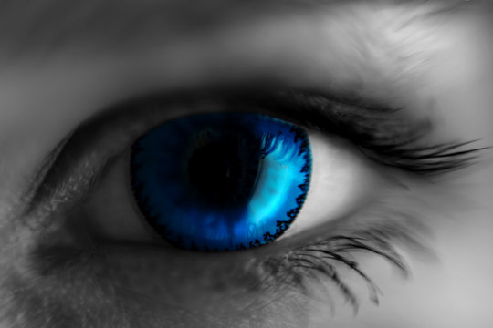 eye in blue lens, blurred at the edges