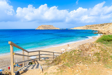 Steps to beautiful beach in Lefkos village on coast of Karpathos island, Greece.