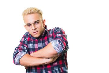 Cheerful guy in glasses posing in studio isolated on white background.