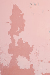 background pink wall with peeling paint, dark spots