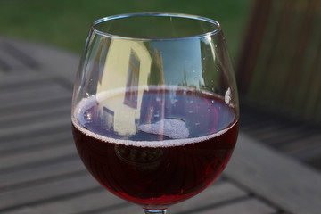 Red Wine Glass Isolated on green Background 