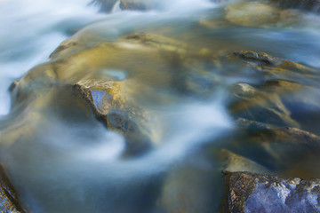 Big rocks in waterfalls of mountains river mountains. Water mountains landscape. Idea for outdoor activities, travel.