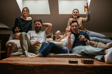 Supporting favorite club from sofa