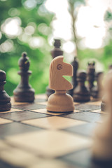 Horse chess figure on a playing board