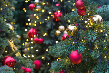 fir-tree decorated with Christmas balls and ribbons, traditional New Year holiday
