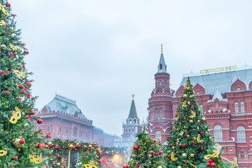 Christmas trees decorated with balls and ribbons, against the backdrop of the Moscow Kremlin, new year