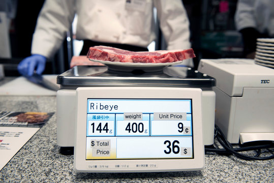 Steak being weighed on a scale