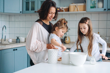 Happy family cook together in the kitchen