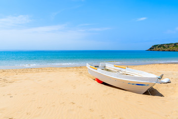 Fototapeta na wymiar Fishing boat on sandy Bolonia beach near Tarifa town, Spain