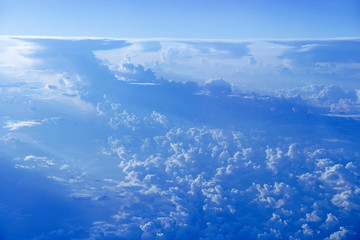 Fototapeta na wymiar blue sky with white clouds. Flight over clouds