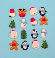 Christmas food decorations.  Christmas symbols. Christmas cookies on blue background from above. Desert.