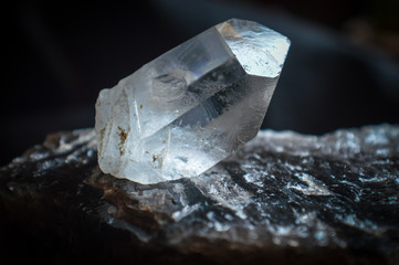 Crystal quartz mineral on black background 