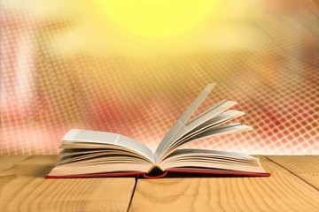 Open book on old wooden table