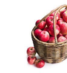 Big basket full of fresh apples isolated on white