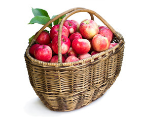 Big basket full of fresh apples isolated on white
