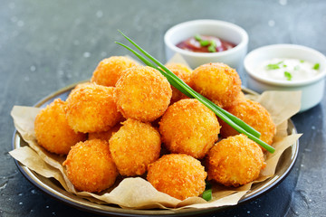 cheese balls with tomato sauce.