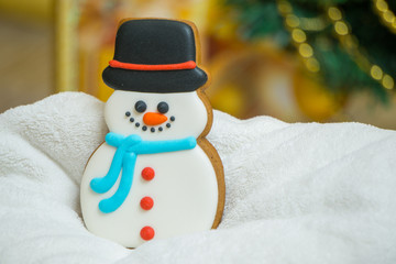 Cake snowman with a hat during Christmas time with Christmas Eve  on the background