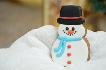 Cake snowman with a hat during Christmas time with Christmas Eve  on the background