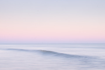 Fototapeta na wymiar Gentle wave at sunset