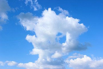 Clear deep blue sky with clouds central