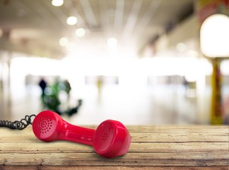 Red telephone receiver  on  background