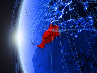 Morocco from space on blue digital model of Earth with international network. Concept of blue digital communication or travel.