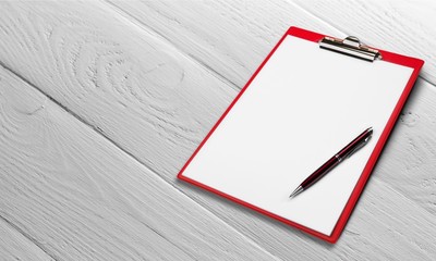 Blank  clipboard with a pen isolated on white background