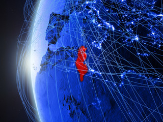 Tunisia from space on blue digital model of Earth with international network. Concept of blue digital communication or travel.