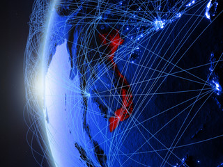 Vietnam from space on blue digital model of Earth with international network. Concept of blue digital communication or travel.