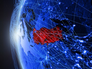 Turkey from space on blue digital model of Earth with international network. Concept of blue digital communication or travel.