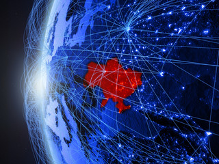 Ukraine from space on blue digital model of Earth with international network. Concept of blue digital communication or travel.