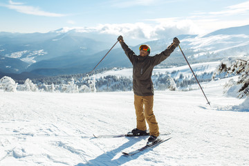 Nice man skiing in the mountains. Good skiing in the snowy mountains,  Winter is coming, first...