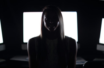 close up.a young woman near the desktop.