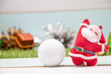 Fototapeta premium Merry Christmas to golfer with golf ball and Christmas ornament 