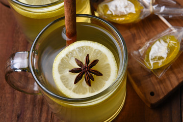 Overhead view of a Hot Toddy in a glass mug on a dark wood table