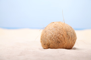 Fototapeta na wymiar Coconut on sand
